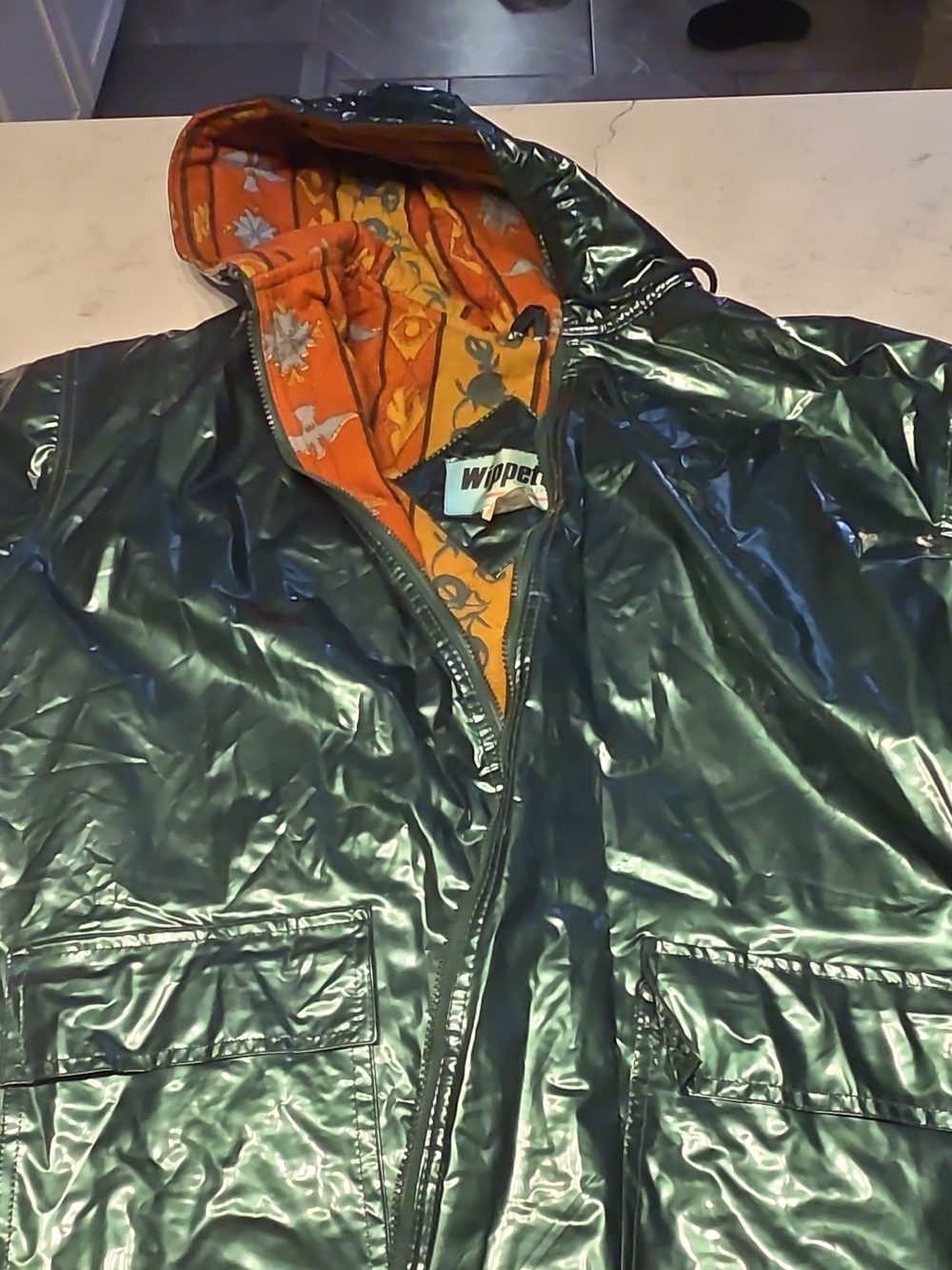 Wippette Glossy Dark Green Raincoat with Orange Floral Hood Lining